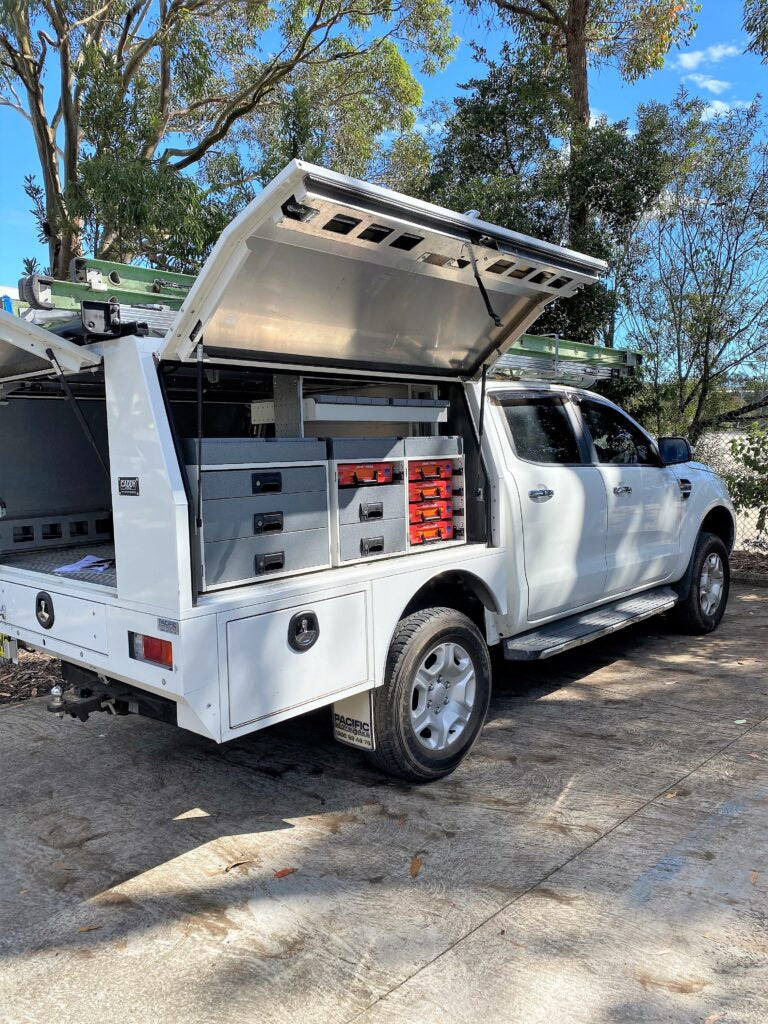 Canopy storage system with lockable compartments for ute