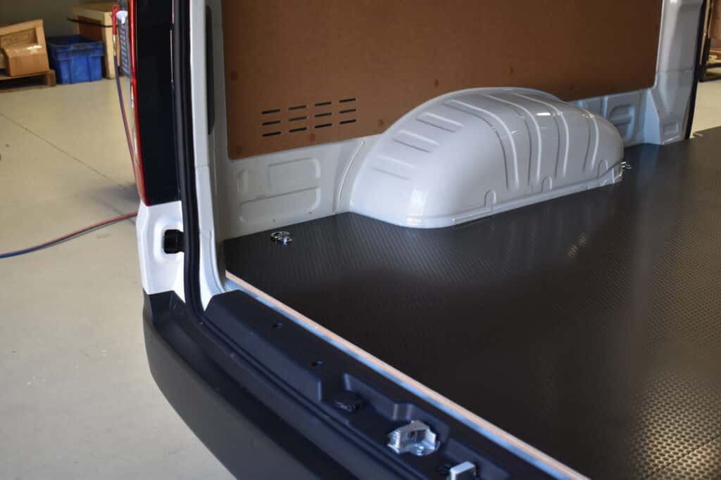 Van flooring installed alongside RolaCase shelving system